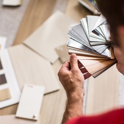 A man viewing paint swatches