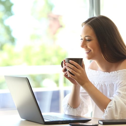 A woman reading reviews on her computer