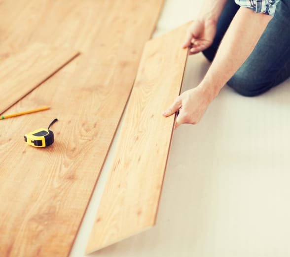 Laying wooden flooring planks